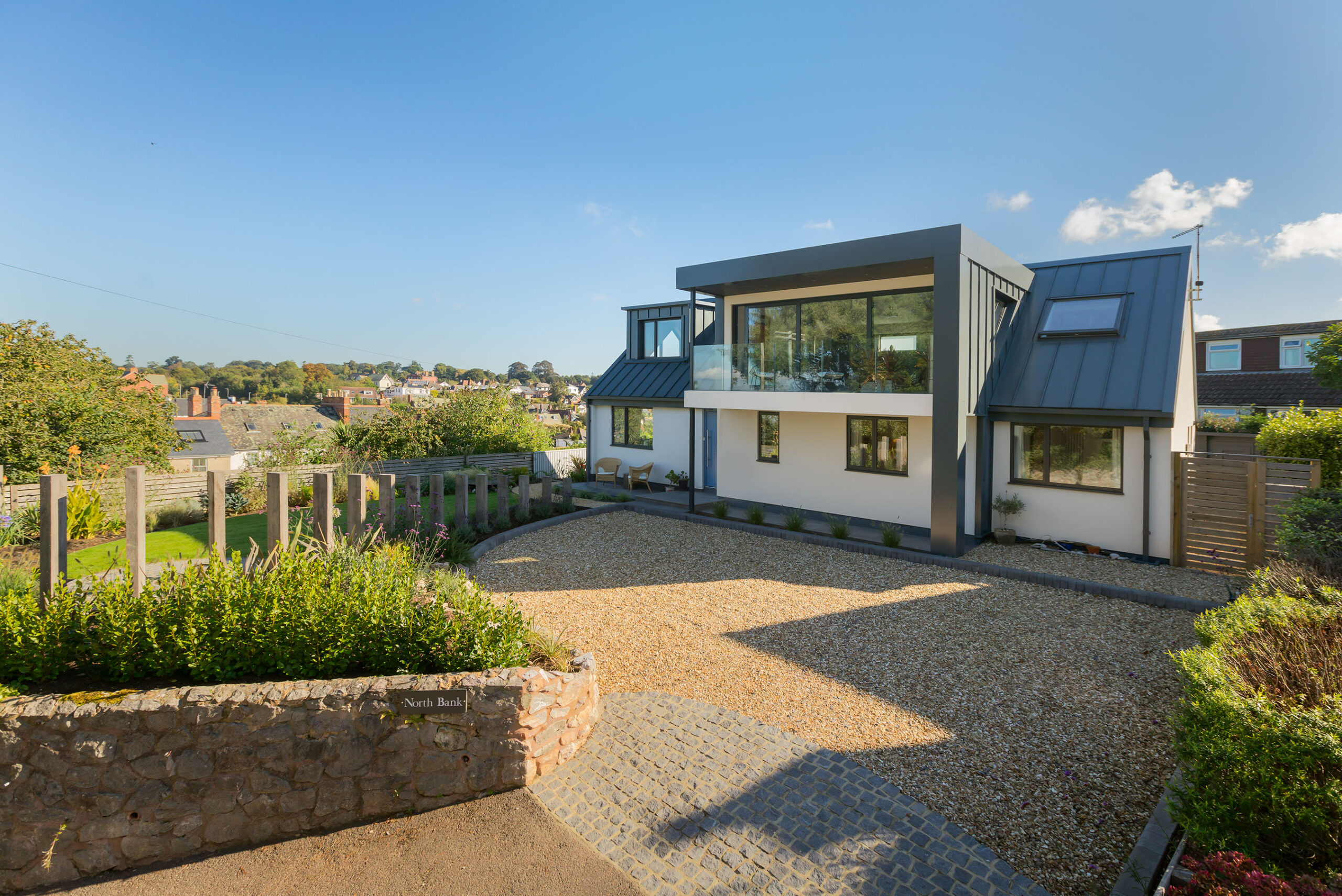New contemporary home in Lympstone showing the front elevation and driveway